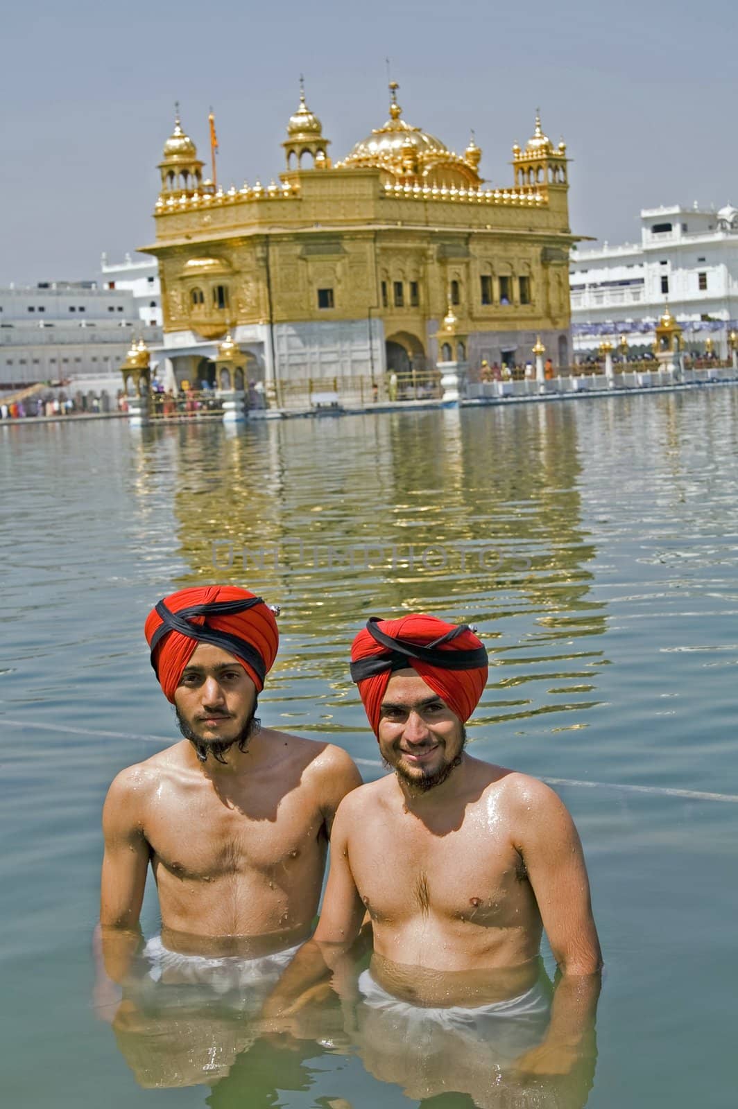 Sikh men bathing in the holy pool at the Golden Temple, Amritsar