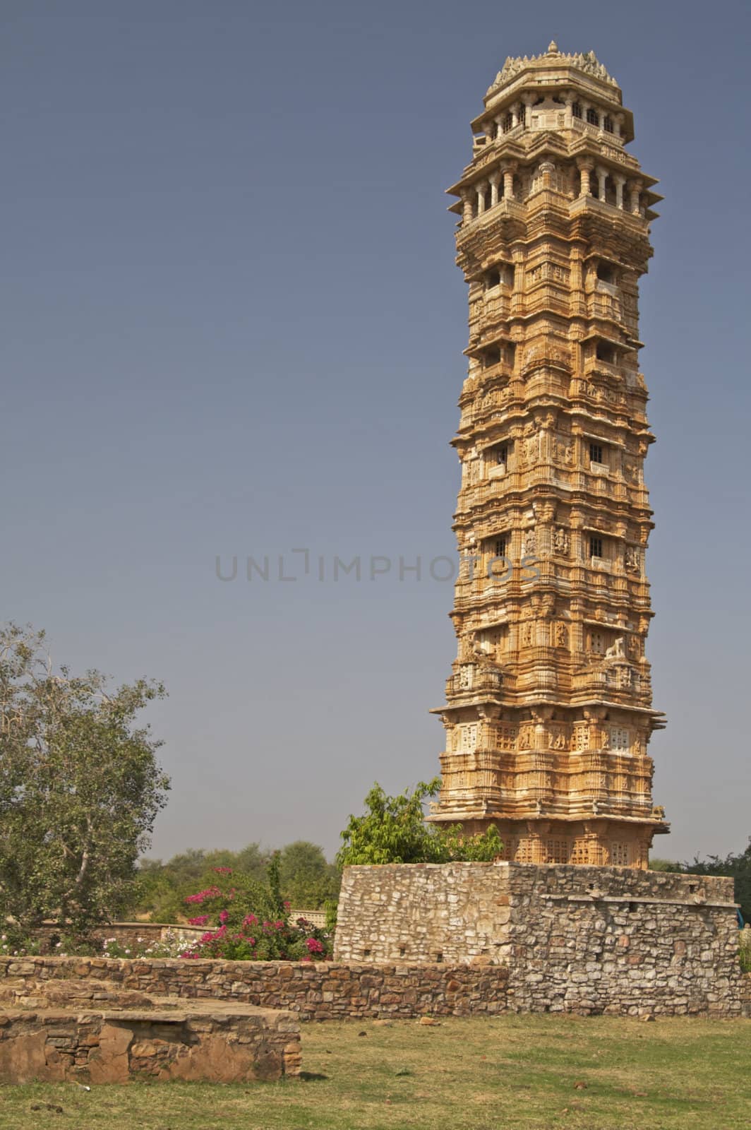 Ornate carved stone victory tower (Vijay Stambha) built to celebrate an ancient victory. Chittaugarh, Rajasthan, India.