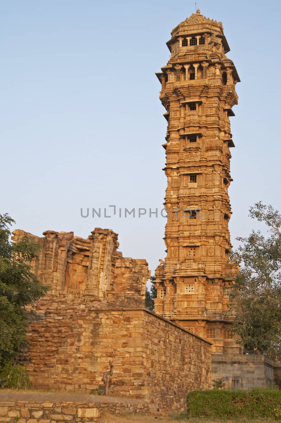 Ornate carved stone victory tower (Vijay Stambha) built to celebrate an ancient victory. Chittaugarh, Rajasthan, India.