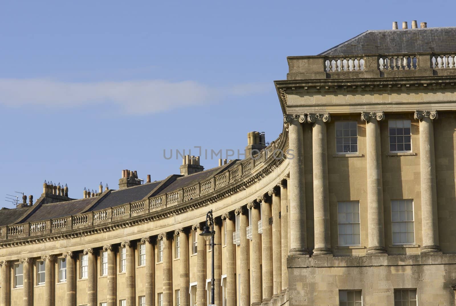 The historic Royal Crescent. Large crescent of houses made from locally mined bath stone. Bath, Somerset, England