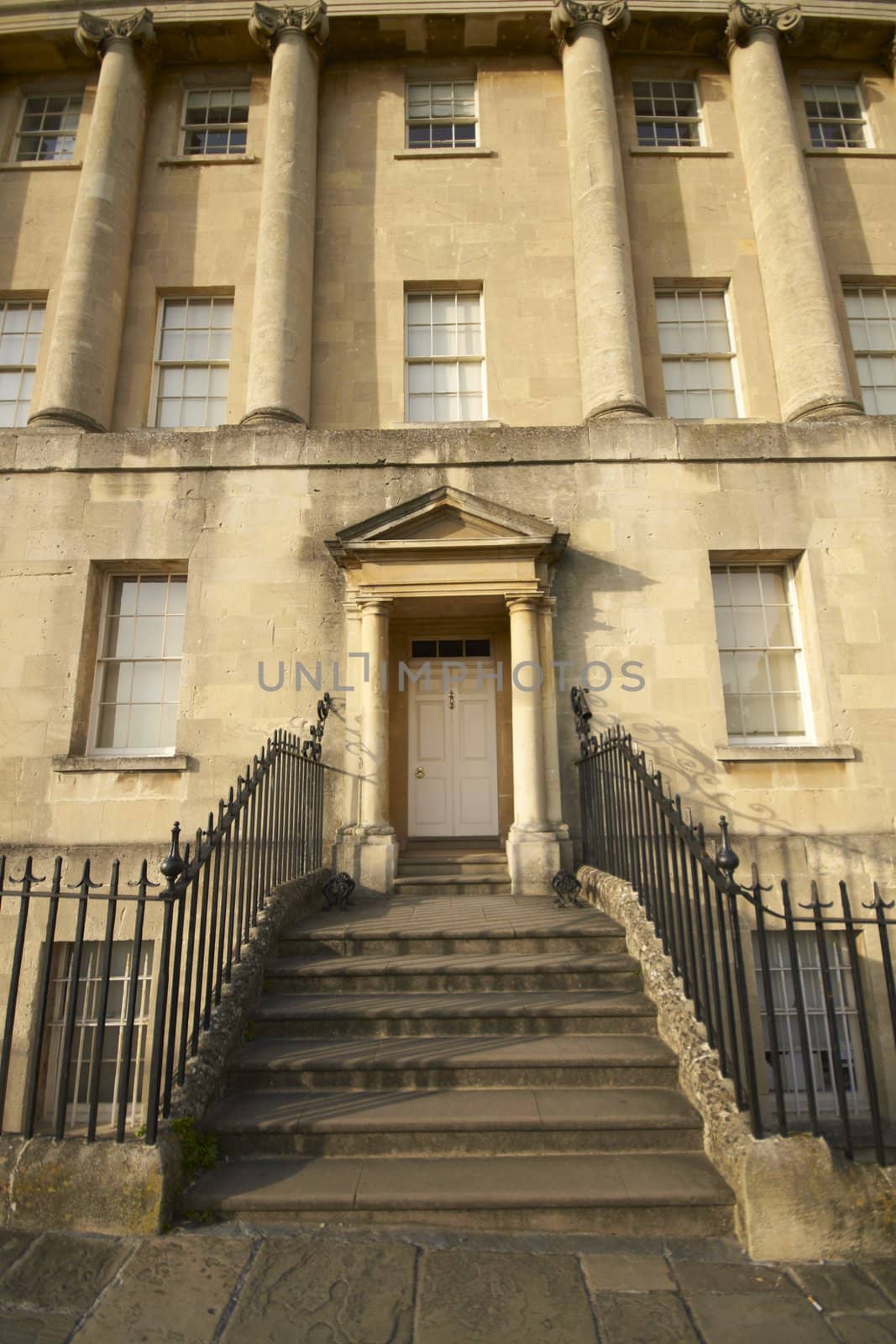 House in the historic Royal Crescent. Large crescent of houses made from locally mined bath stone. Bath, Somerset, England