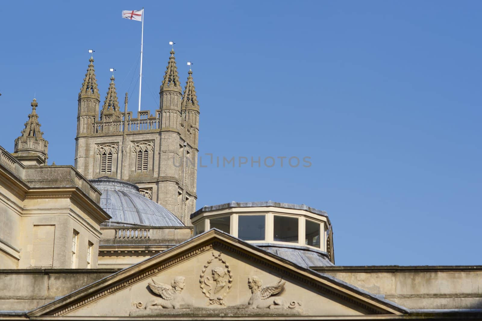 Tower of Bath Abbey above the historic Roman Baths, in Bath, Somerset, England