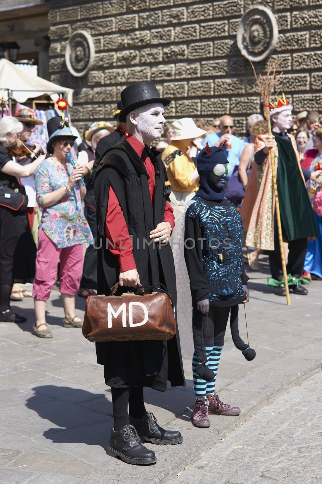 Street artists re-enacting the story of St George and the dragon in Bath, Somerset, England as part of the St Georges Day celebrations.