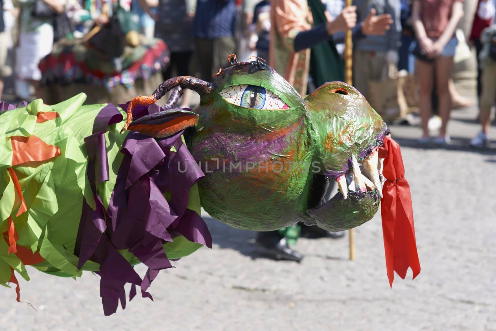 Street artists re-enacting the story of St George and the dragon in Bath, Somerset, England as part of the St Georges Day celebrations.