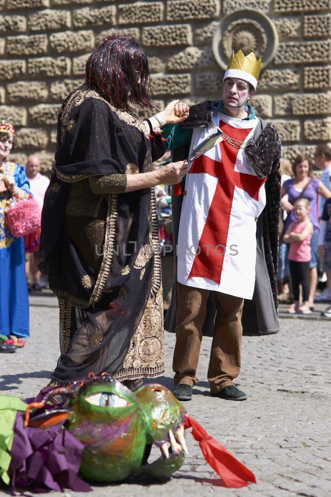 Street artists re-enacting the story of St George and the dragon in Bath, Somerset, England as part of the St Georges Day celebrations.