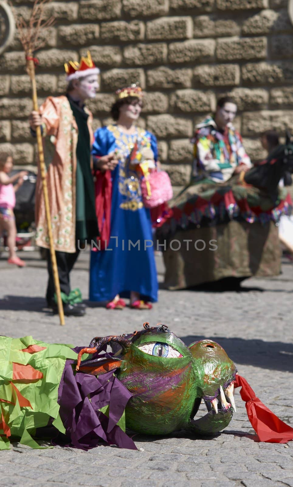 Street artists re-enacting the story of St George and the dragon in Bath, Somerset, England as part of the St Georges Day celebrations.