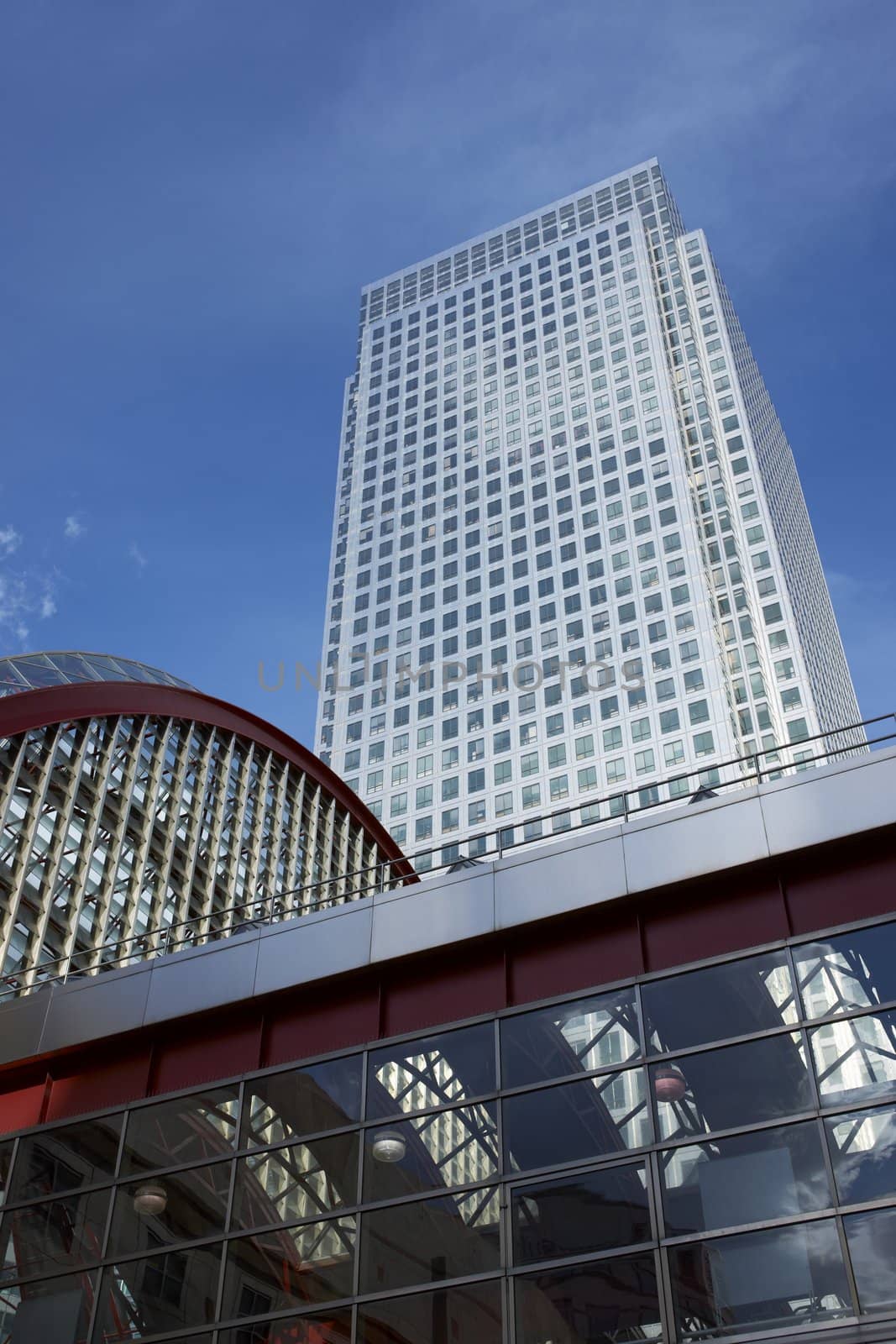 Modern office building towers above the Docklands Light Railway Station at Canary Wharf, London, England