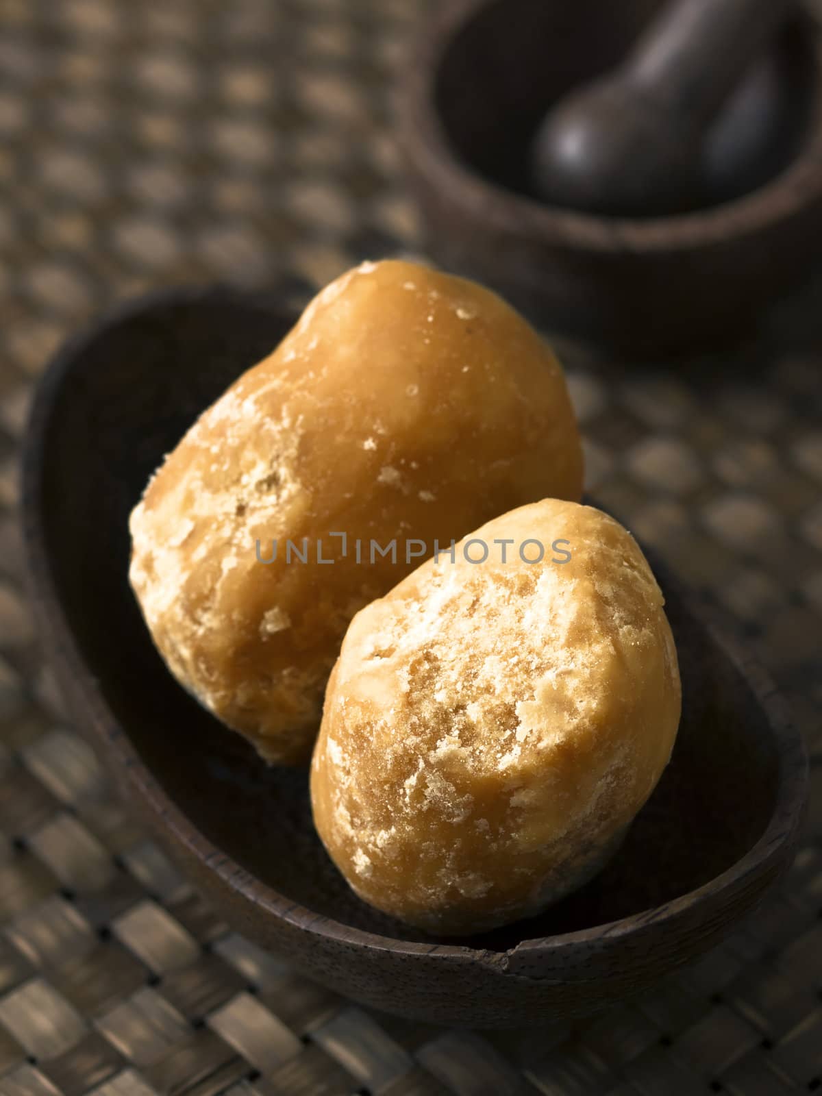 close up of a bowl of jaggery balls