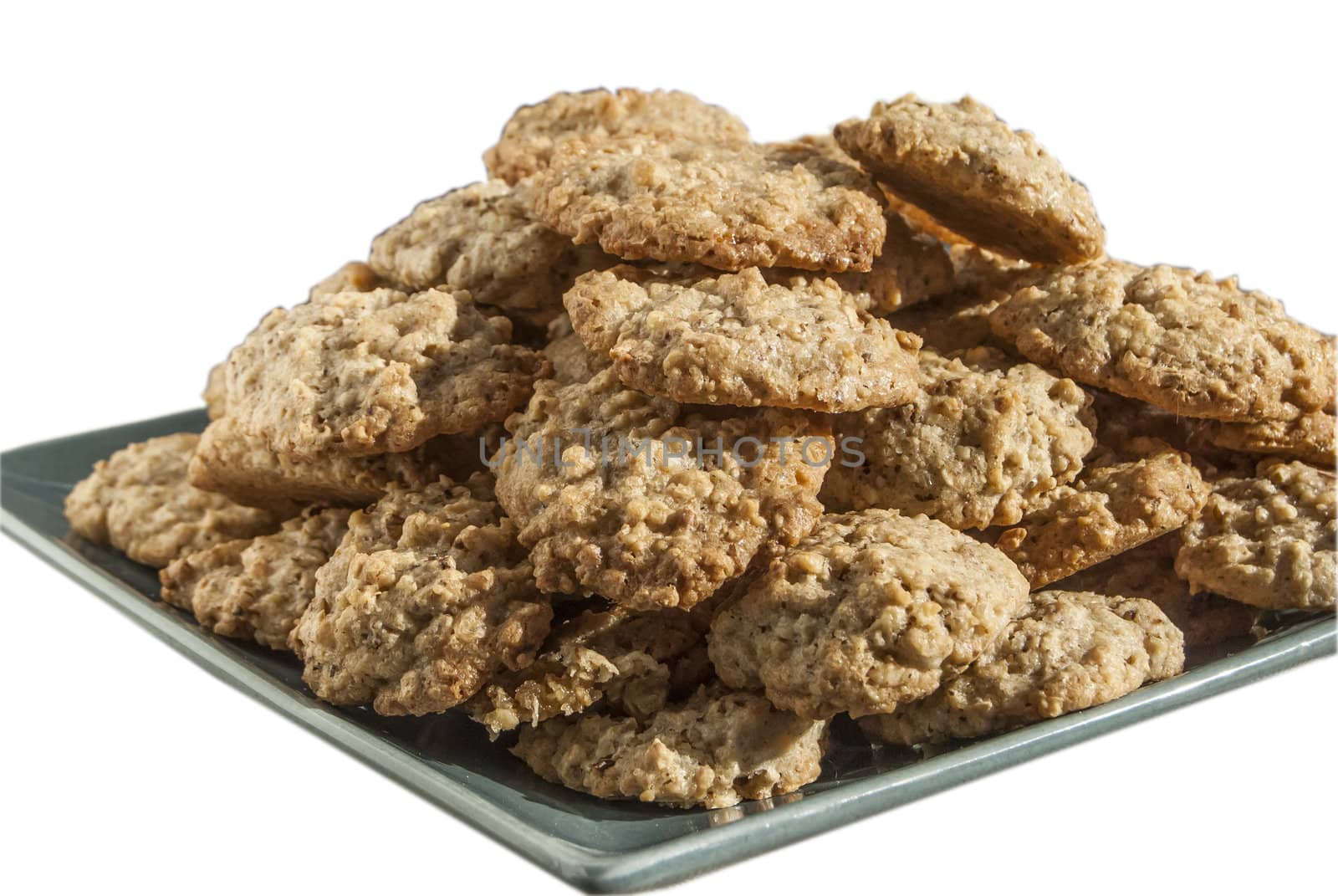 Homemade oatmeal cookies plate isolated on white background
