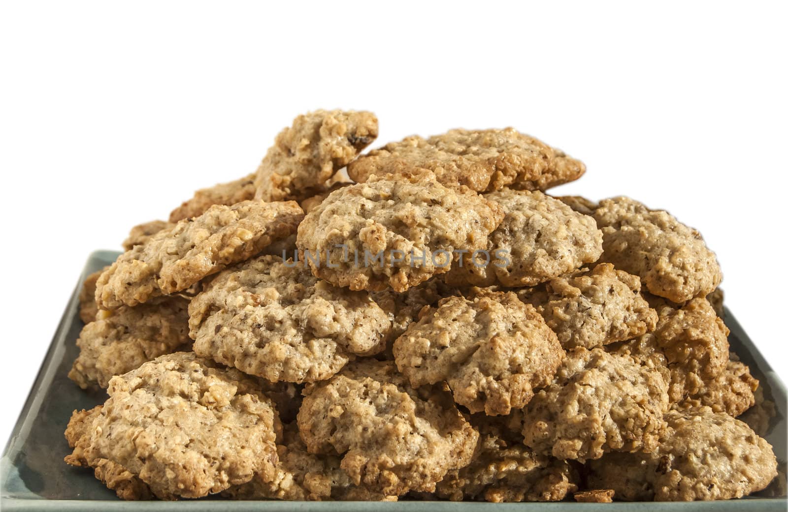 Homemade oatmeal cookies plate isolated on white background