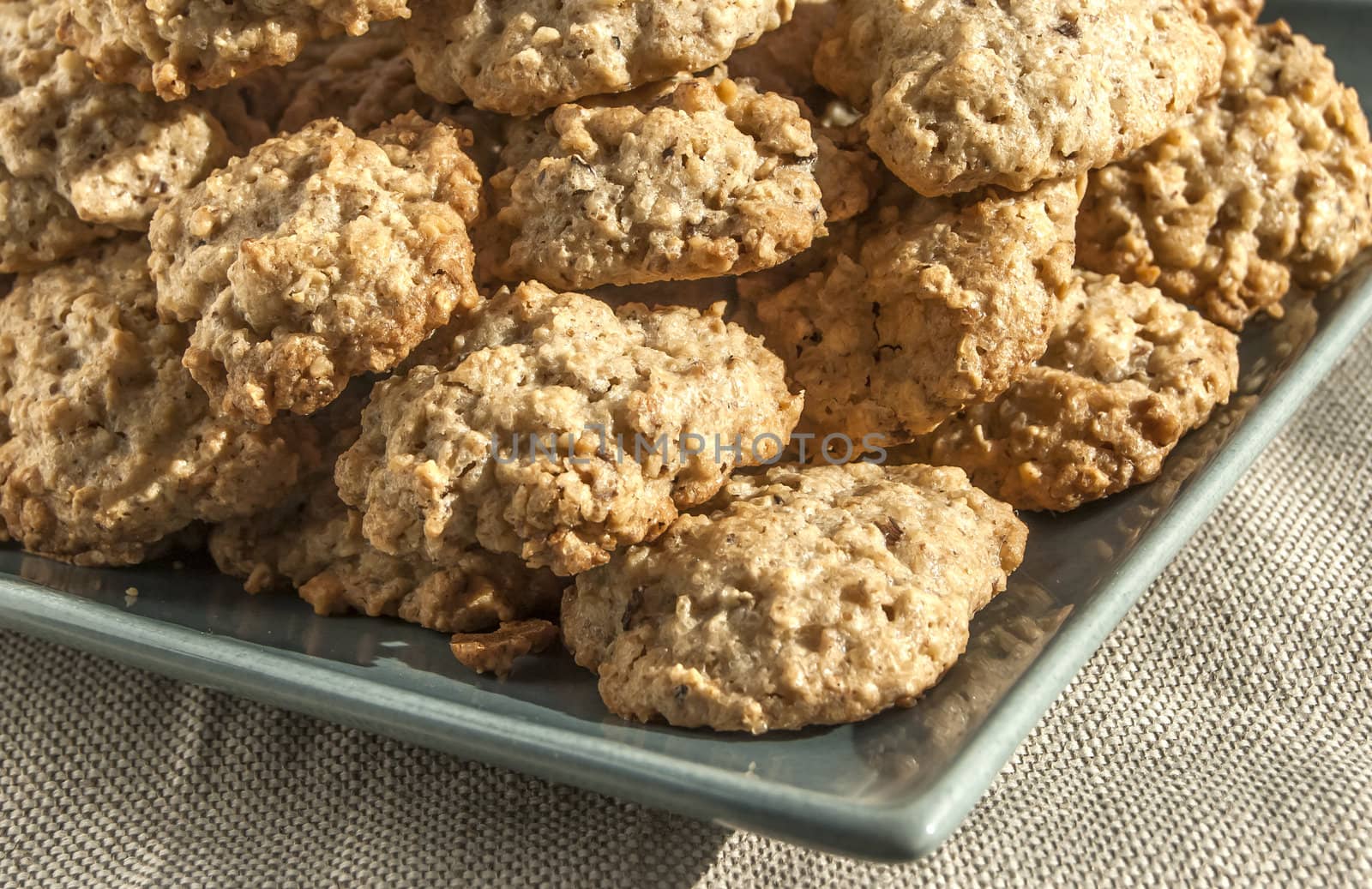 Homemade oatmeal cookies plate corner on linen cloth