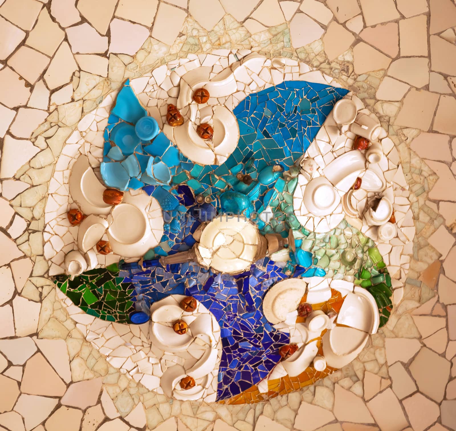 Please check again.  Photographs in Guell Park can be commerical and editiorial.
Antoni Gaudi ceramic mosaic design in Guell Park, Barcelona, Catalonia, Spain.  Guell Park is a residential complex designed by Antnoi Gaudi between 1900-1914, which is now a public park.  Now a UNESCO World Heritage Site.  Design created by plates.