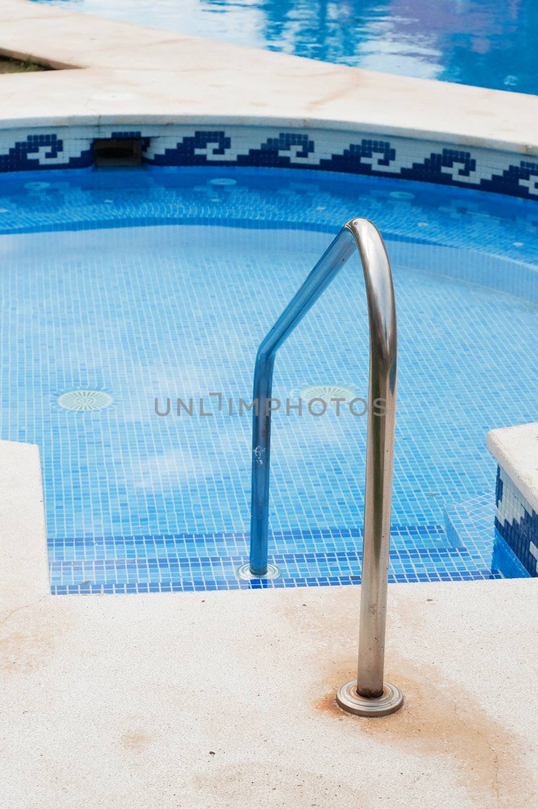 Blue swimming pool with stairs, outdoor shooting