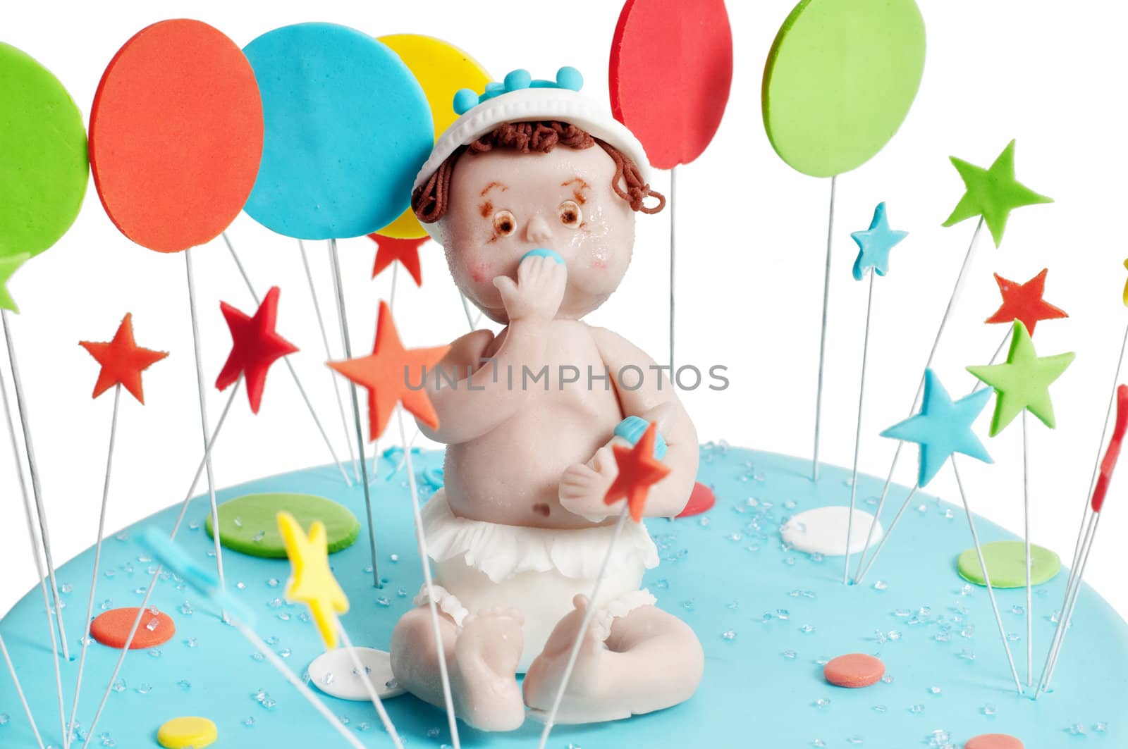 Studio shot of blue birthday cake on light background