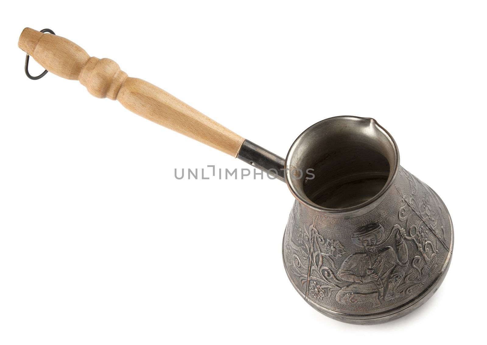 Copper coffe pot with wooden handle on the white