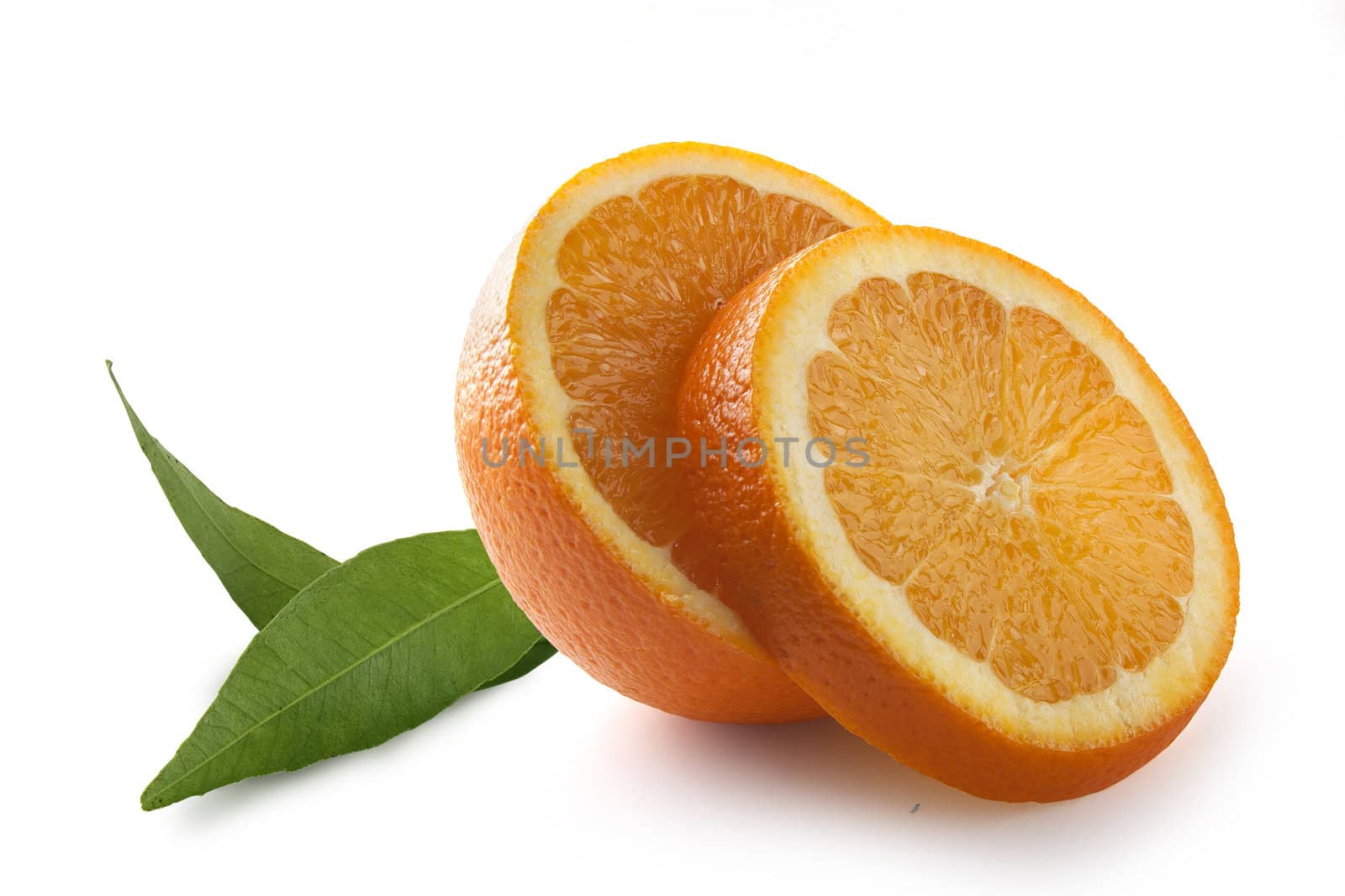 Fresh cut off oranges with green leaves on the white