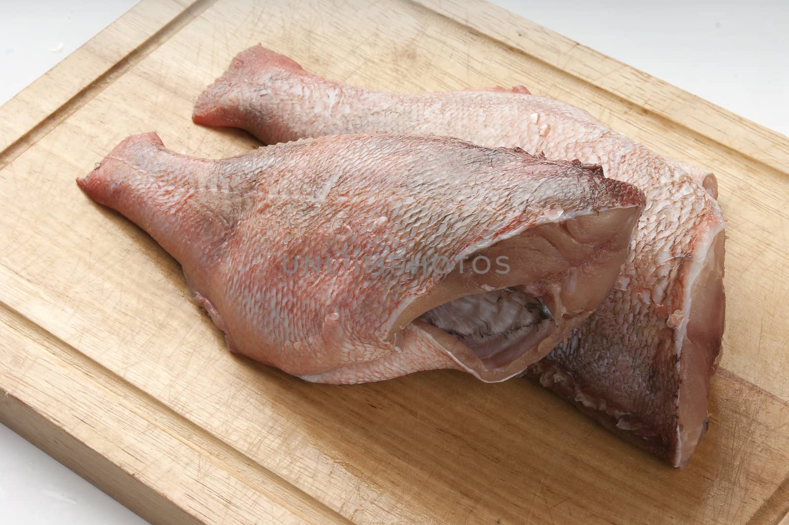 Two trunk of rosefish on the wooden board