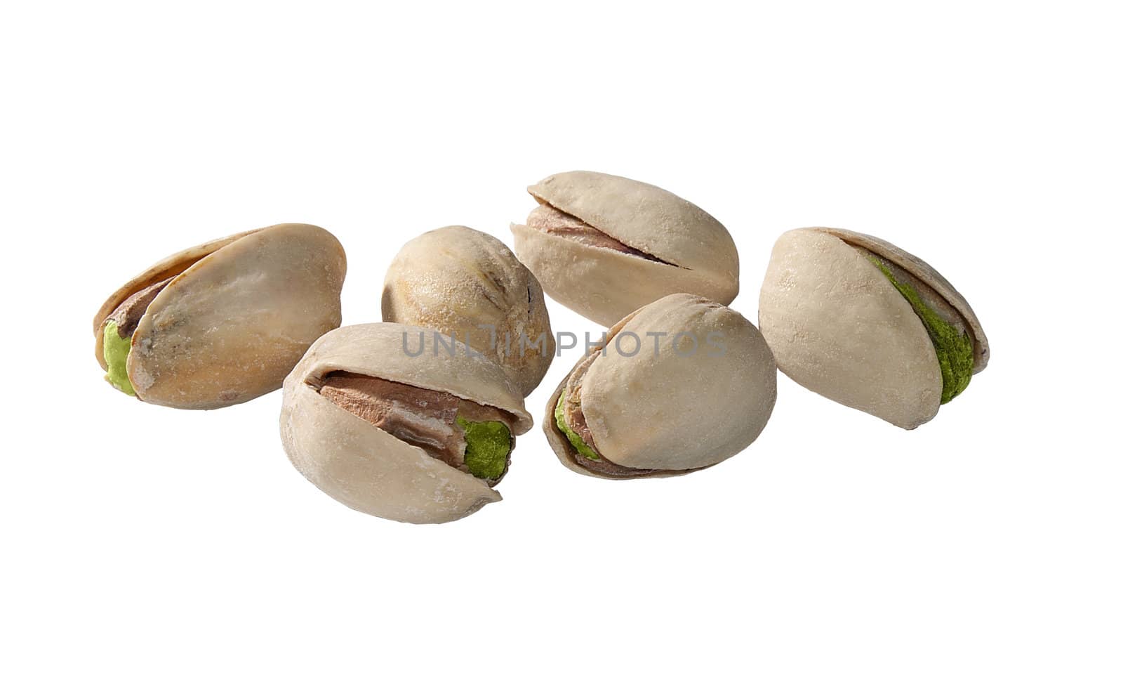 Some isolated pistachios on the gray background