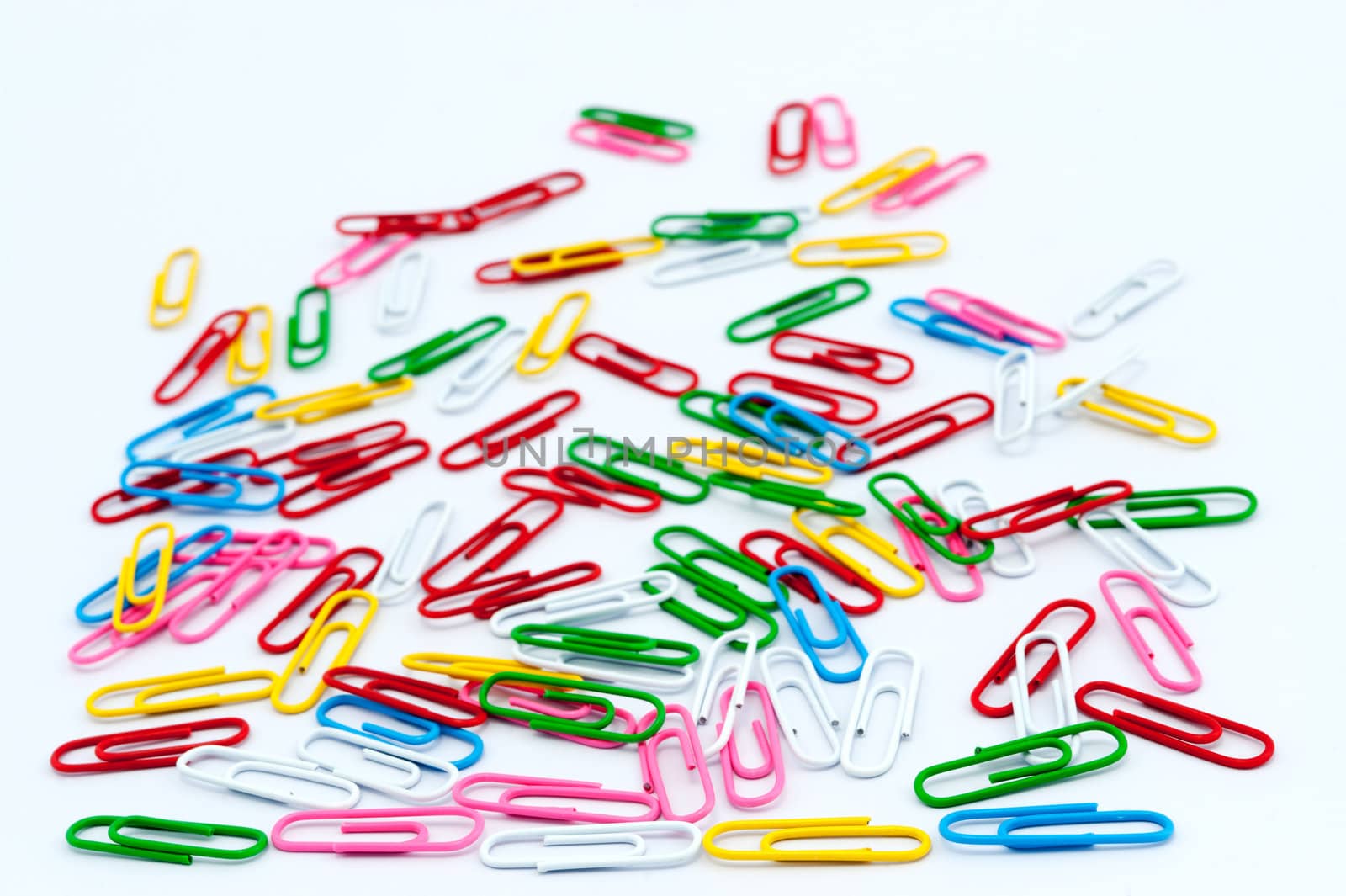 Group of colorful paper clips on white background