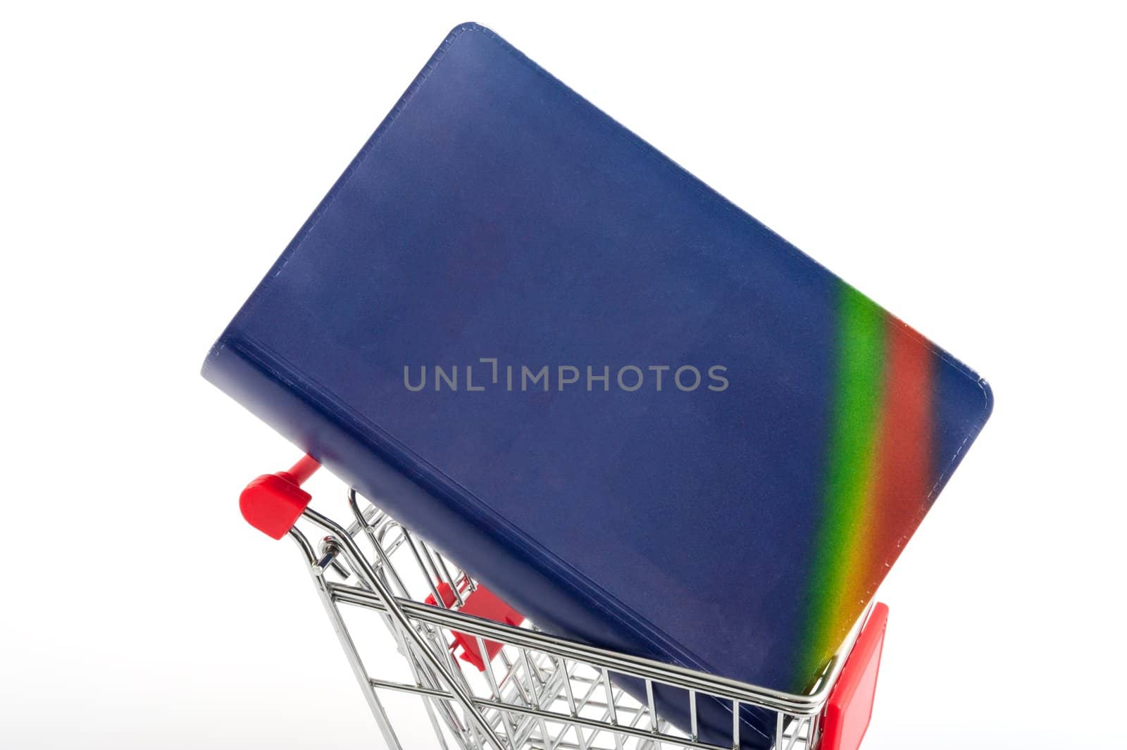 Book in a shopping cart isolated on white
