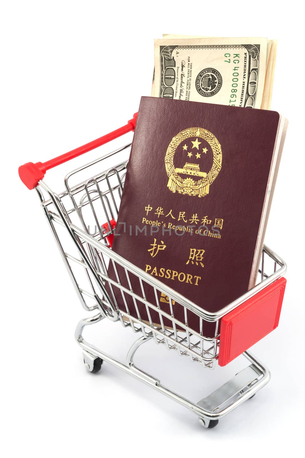 Shopping cart with chinese passport and dollars on white background