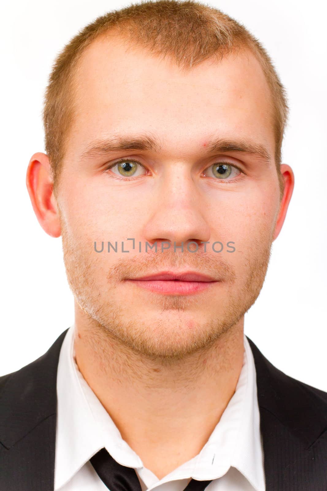 This handsome groom is isolated against a white background in the studio to create a portrait of a man that could be getting married or could be a business person.