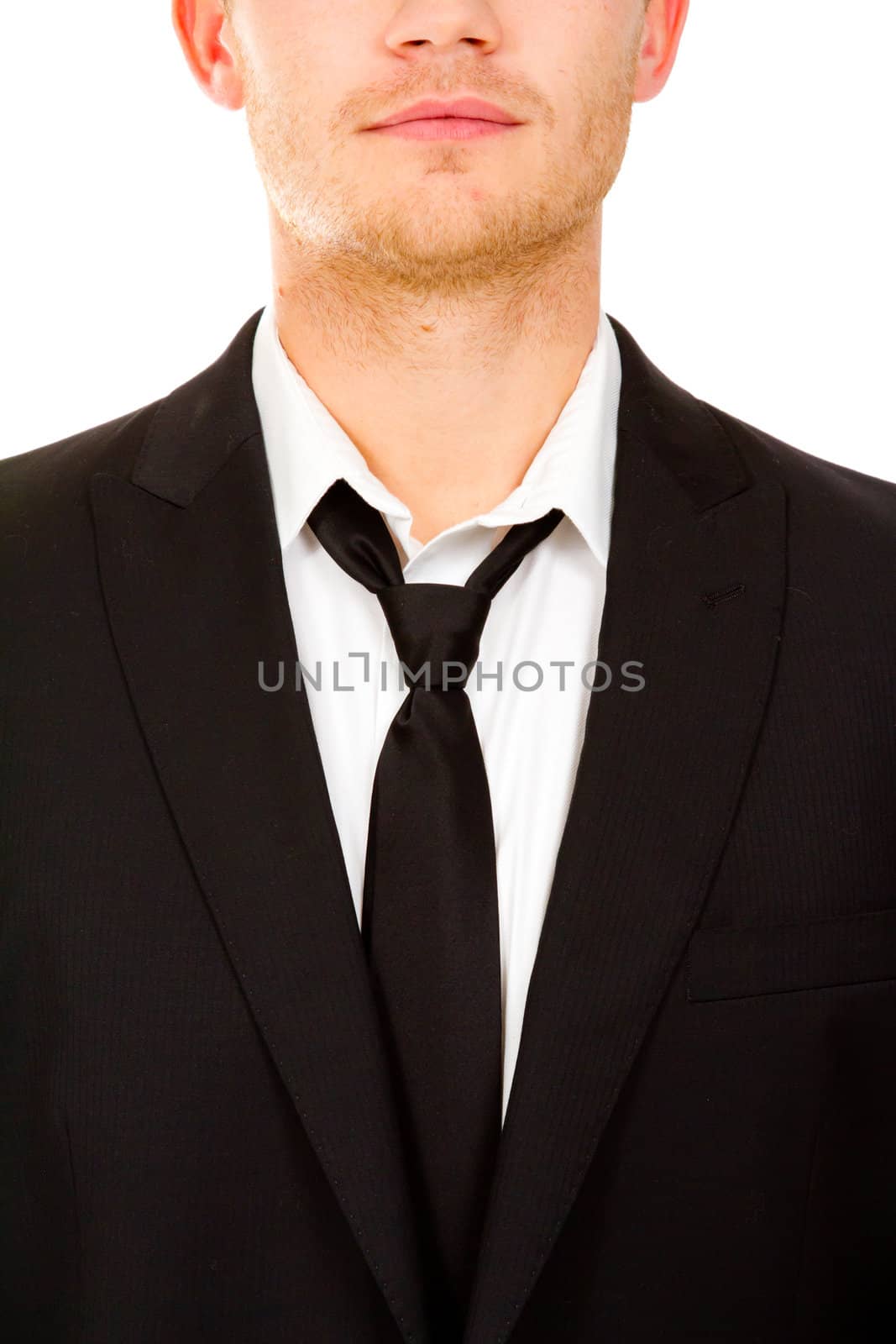 This handsome groom is isolated against a white background in the studio to create a portrait of a man that could be getting married or could be a business person.