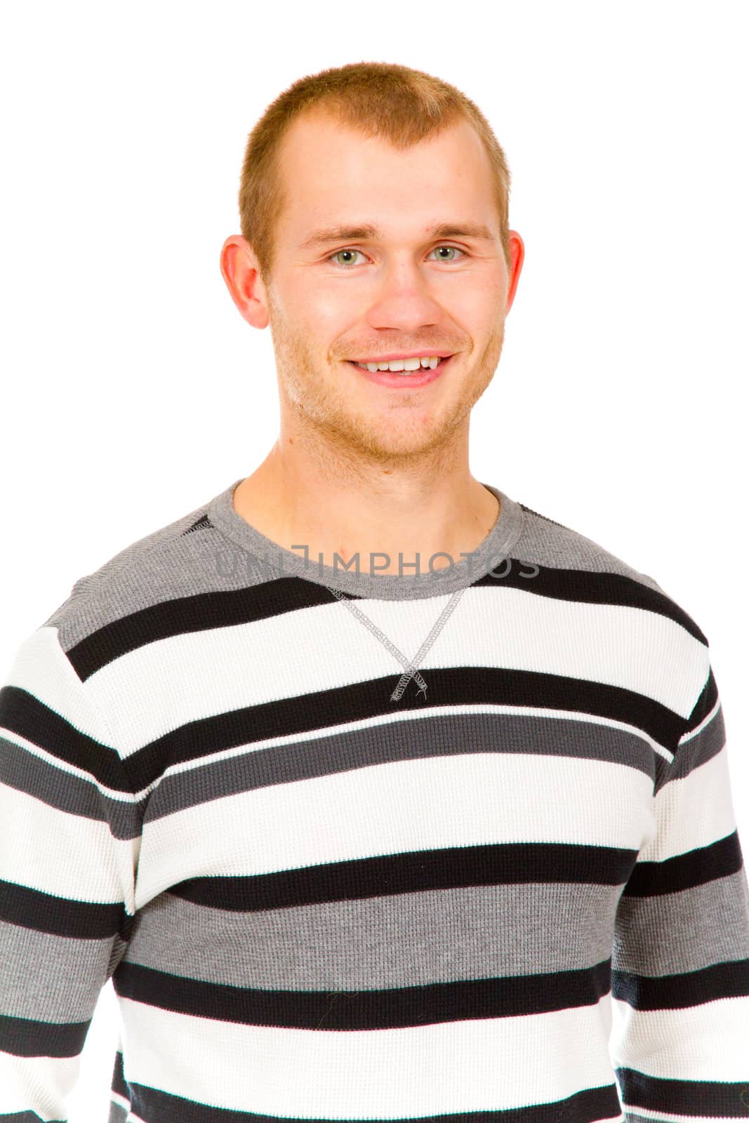 A fashion portrait of a guy in the studio against a white isolated background.