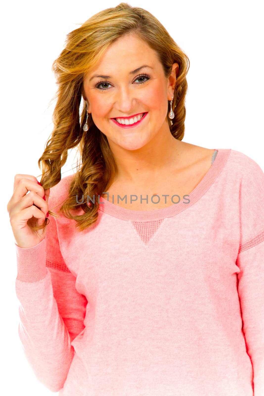 A beautiful woman in the studio against an isolated white background to create this fashion style portrait.