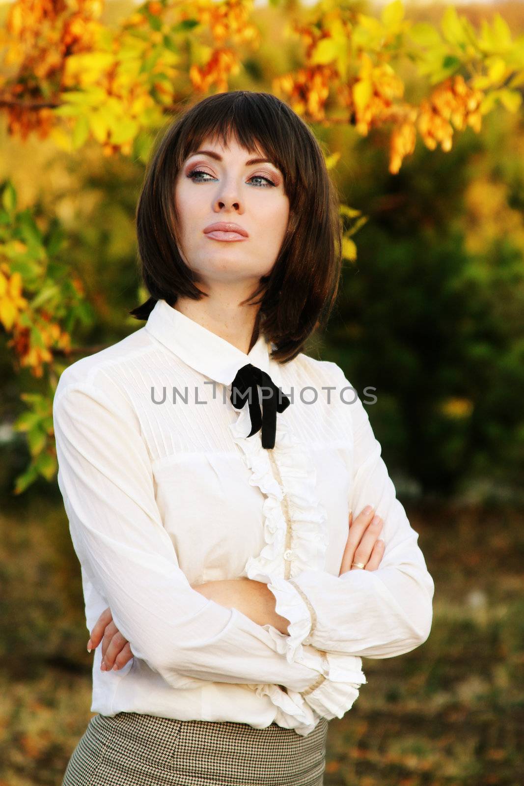 Retro brunette woman in autumn park by Angel_a