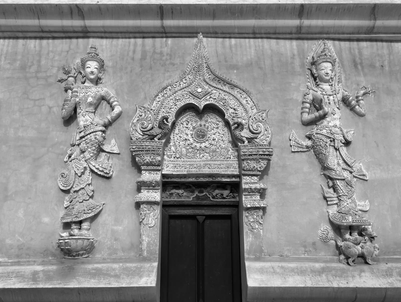 Black and White of The Thai art stucco angels and Front Door