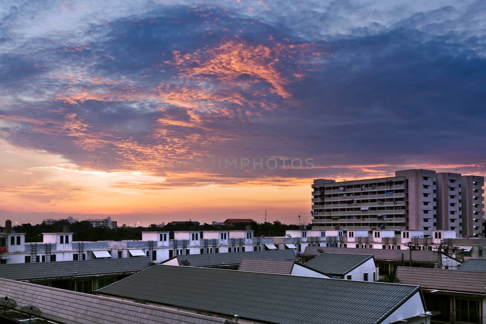 Red Cloud Sunrise in Town by nuttakit