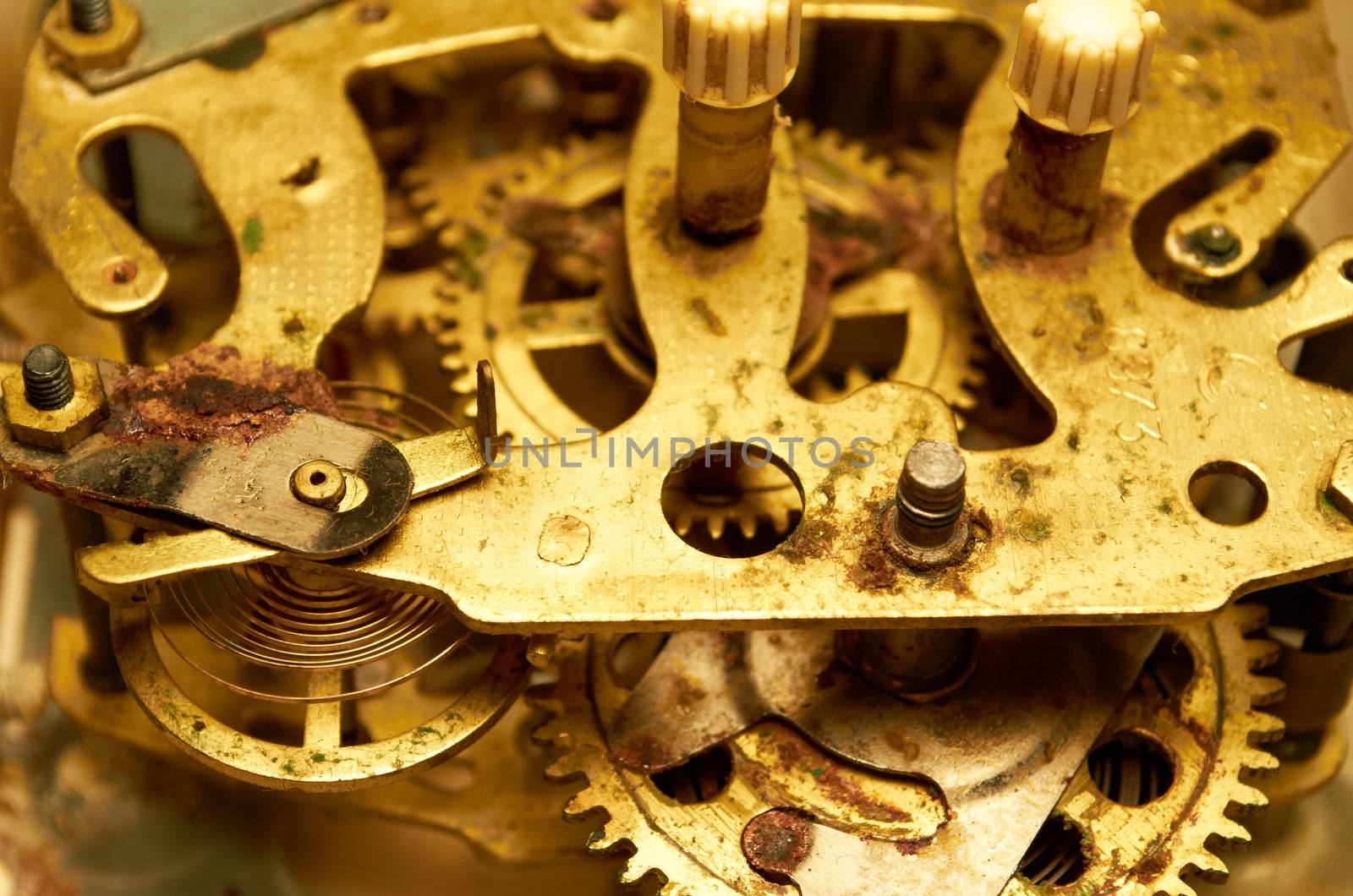 Old rusty gears of hours close up