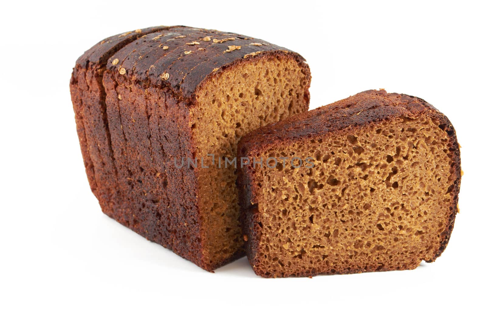 Fresh rye sliced ​​bread sprinkled with coriander on a white background