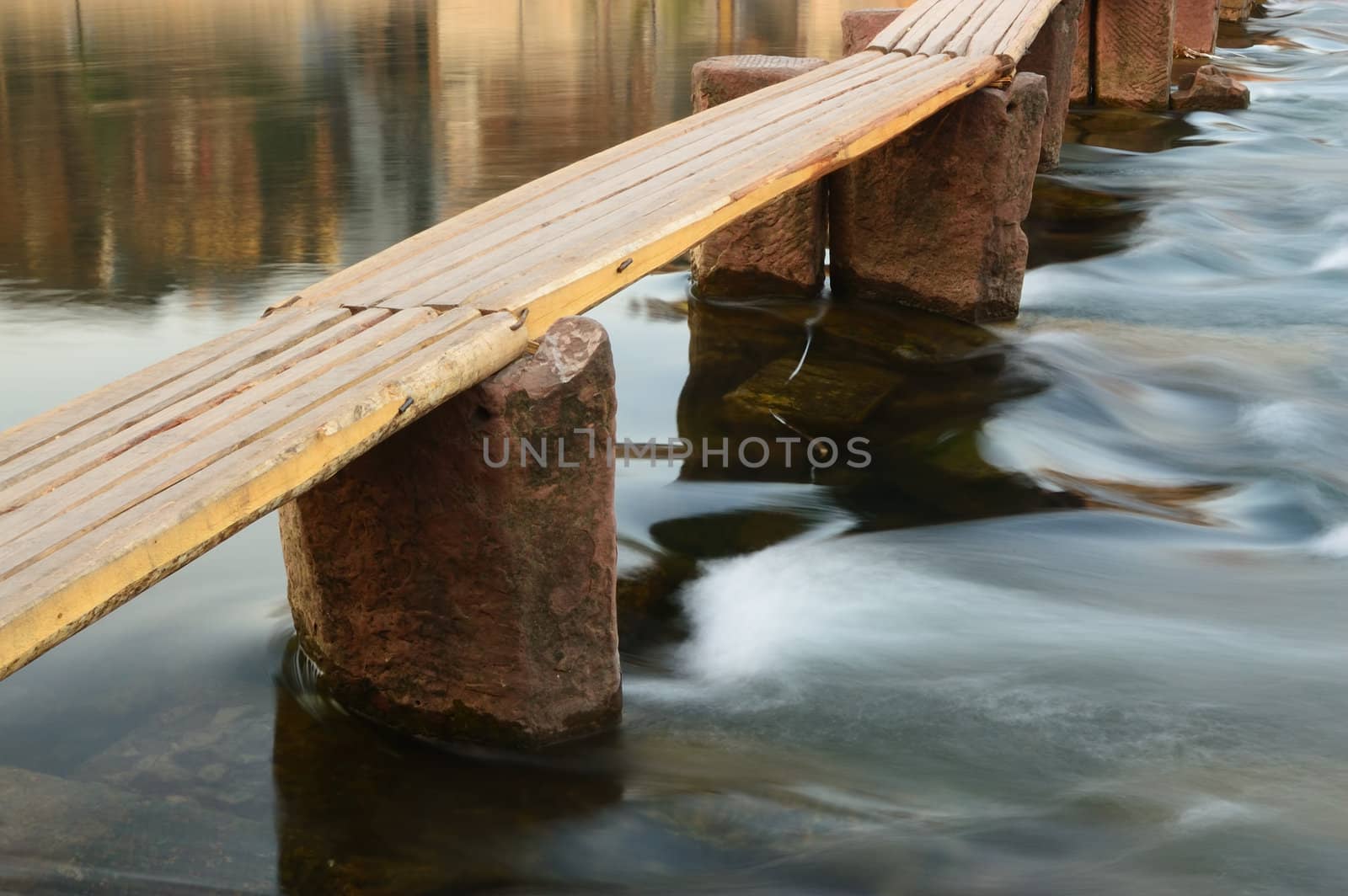 Wooden bridge on the river by raywoo
