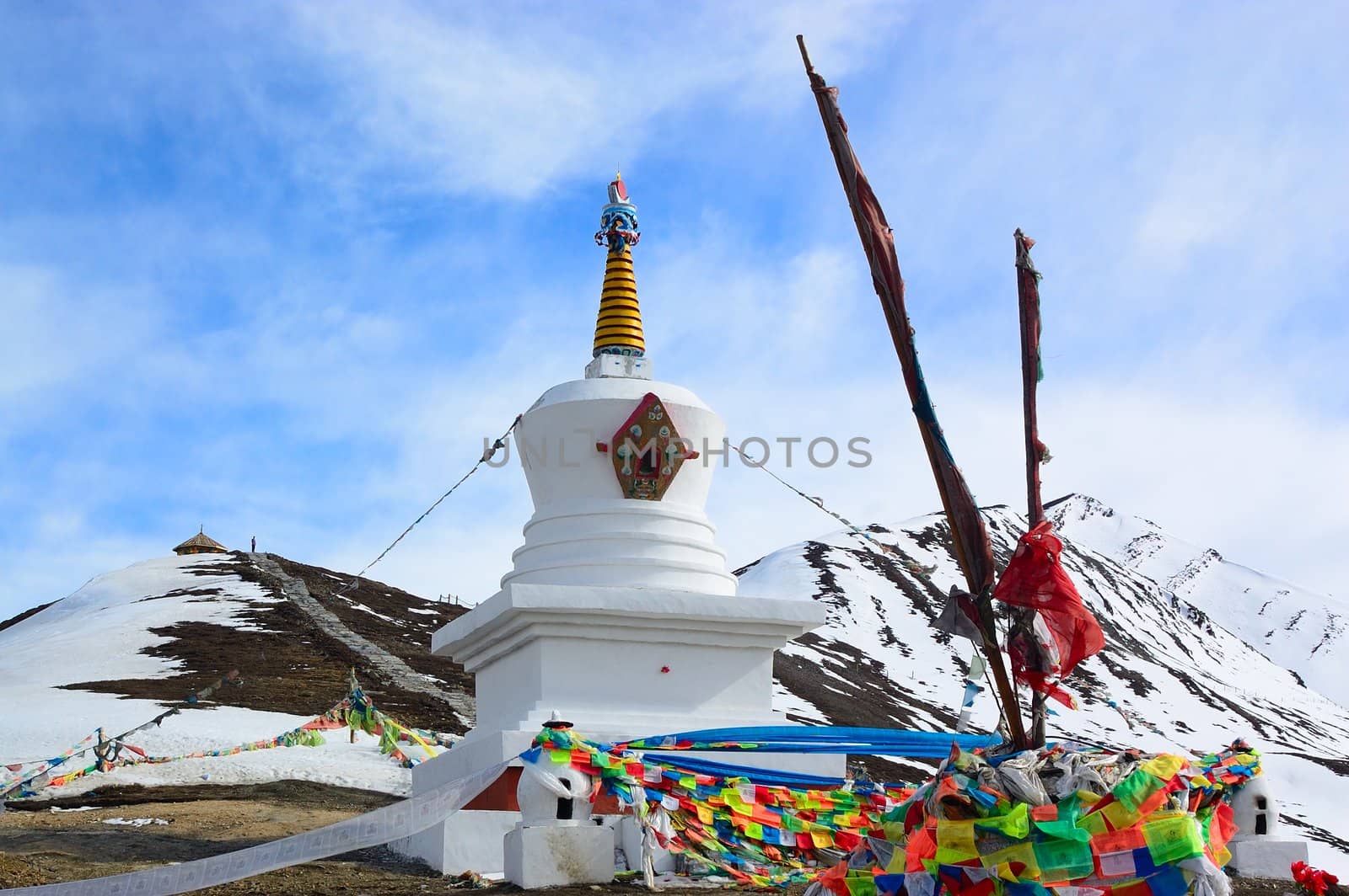 White Tibetan pagoda near the snow mountain in Sichuan province, China