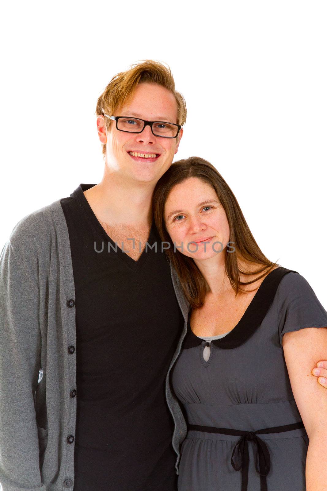 A man and woman pose for this family portrait in the studio against an isolated white background.