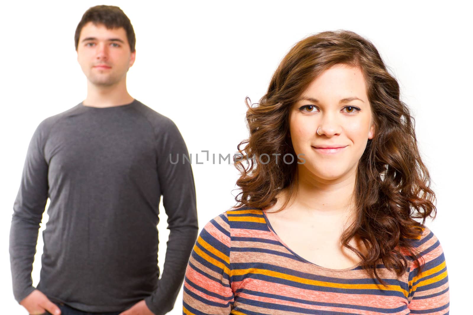 A man and a woman in a studio against an isolated white background for this simple portrait.