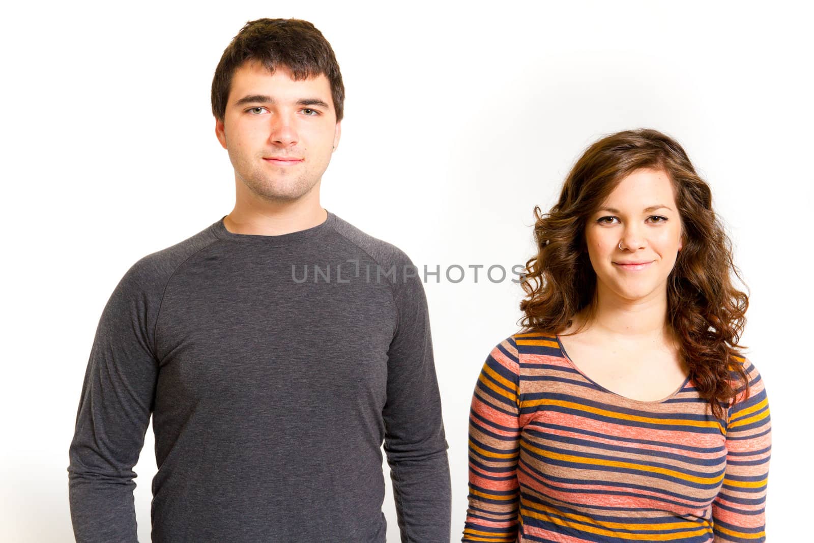 A man and a woman in a studio against an isolated white background for this simple portrait.