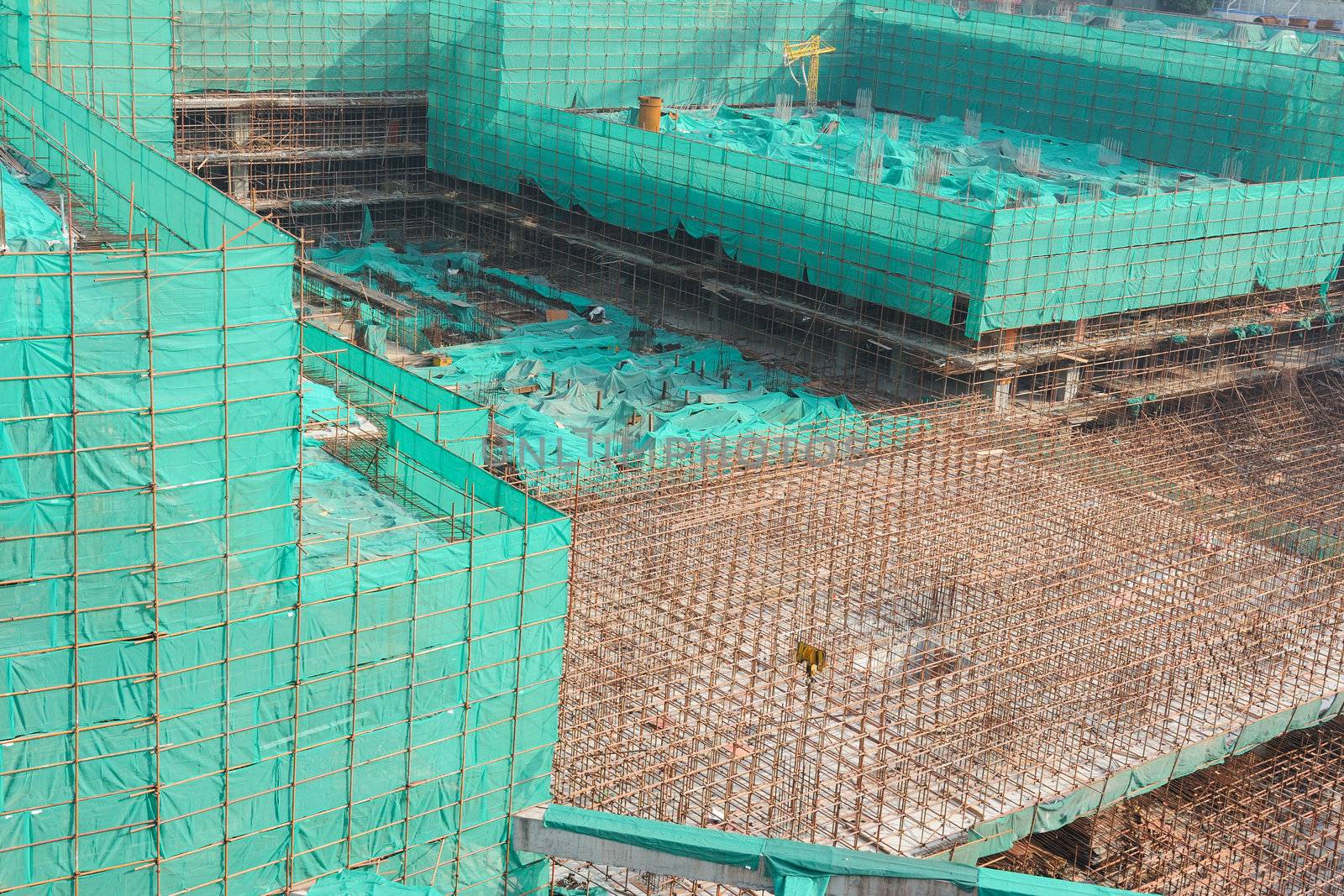 Construction site covered with green net in Guangzhou, China
