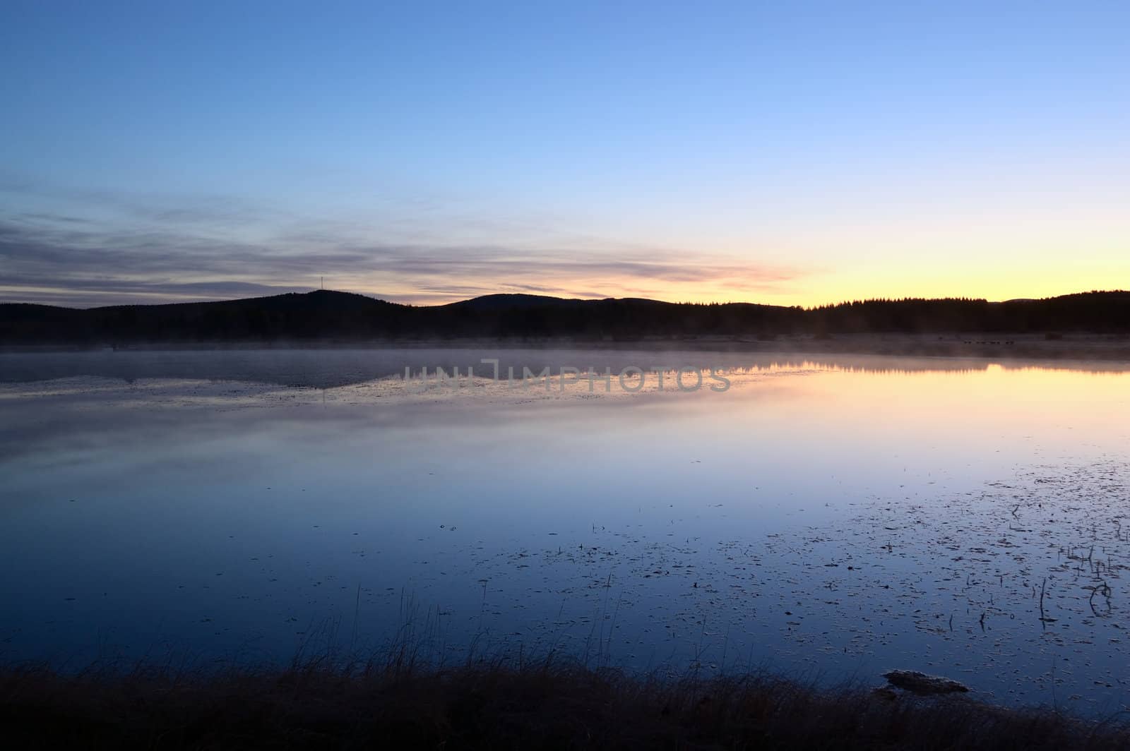 Landscape of lake sunrise at dawn near the grassland in Hebei province of China