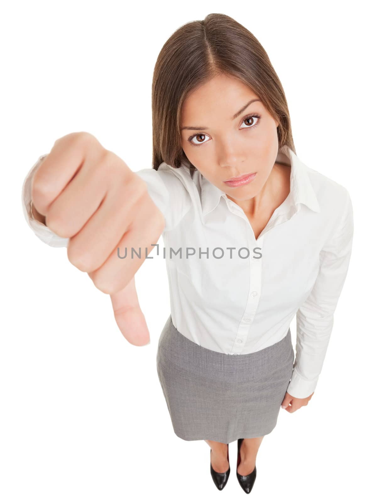 Sad young business woman making a thumbs down sign looking with disapproval background in high angle view in full length. Mixed race ethnic Asian Chinese / Caucasian businesswoman.