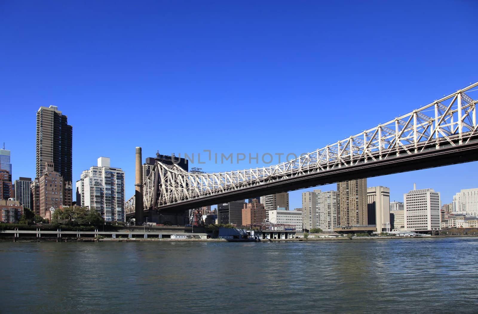 Queensboro Bridge Spanning the East River in New York City on a sunny day