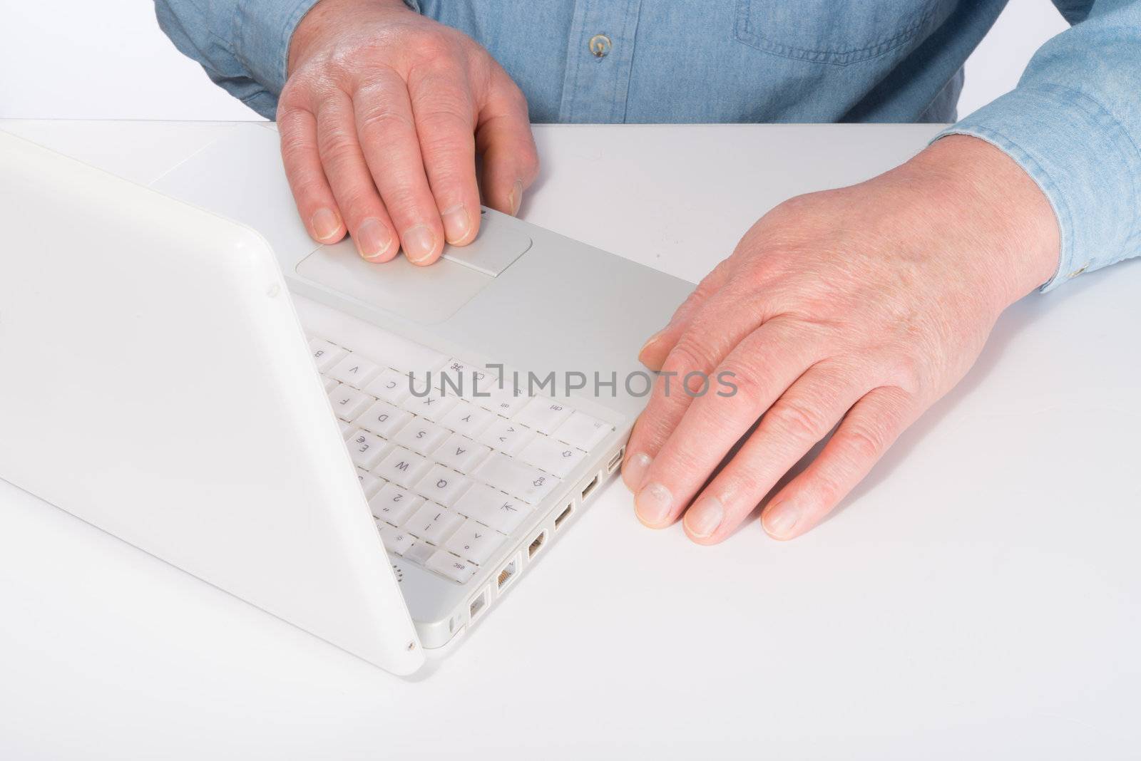 Mature man with laptop by Darius.Dzinnik