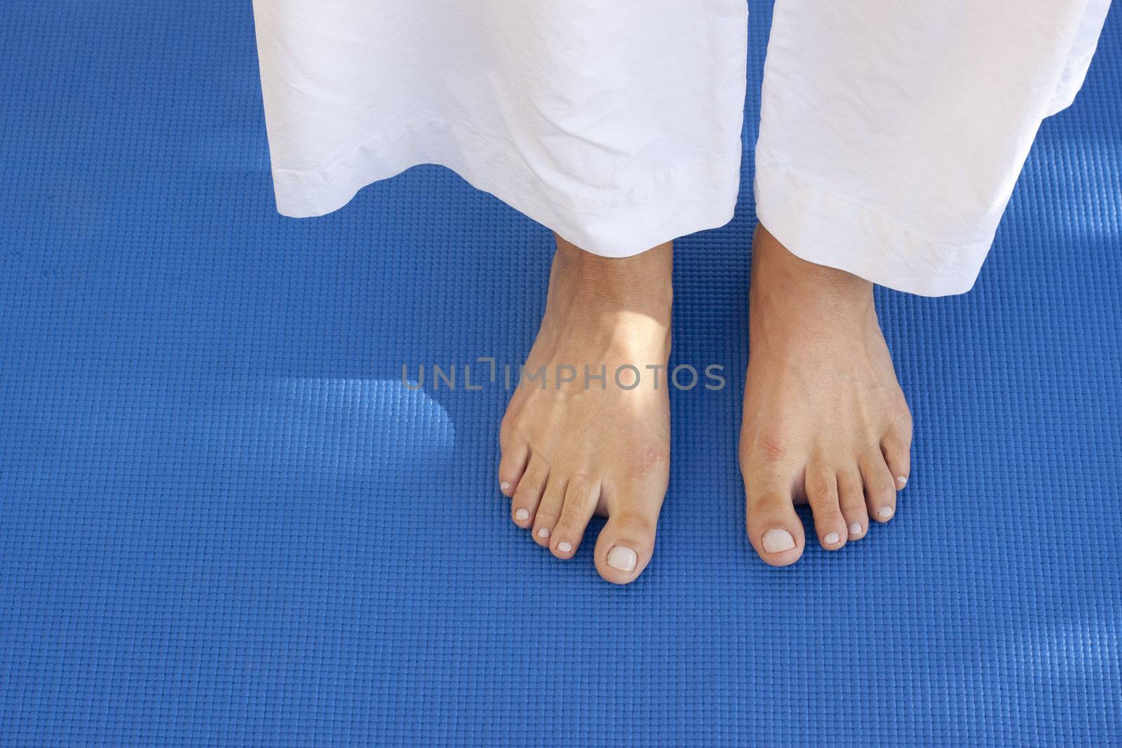 Feet on a blue mat by annems