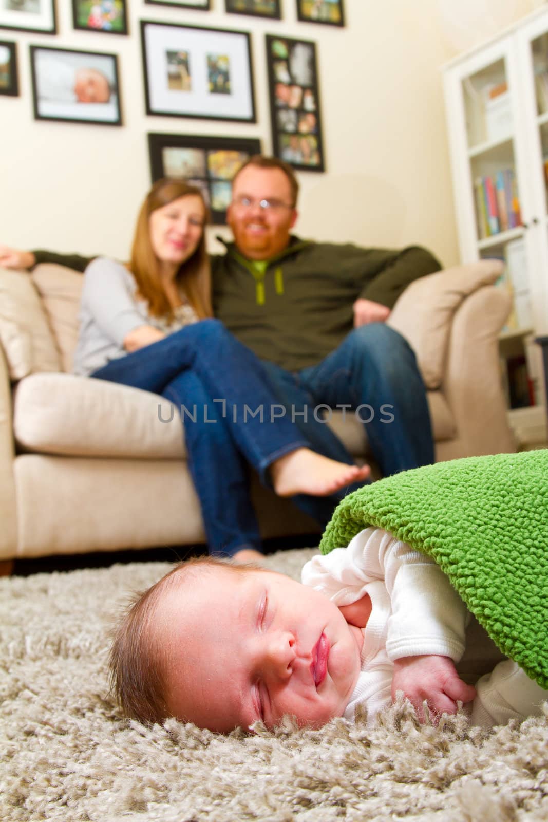 Parents with Newborn Baby Boy by joshuaraineyphotography