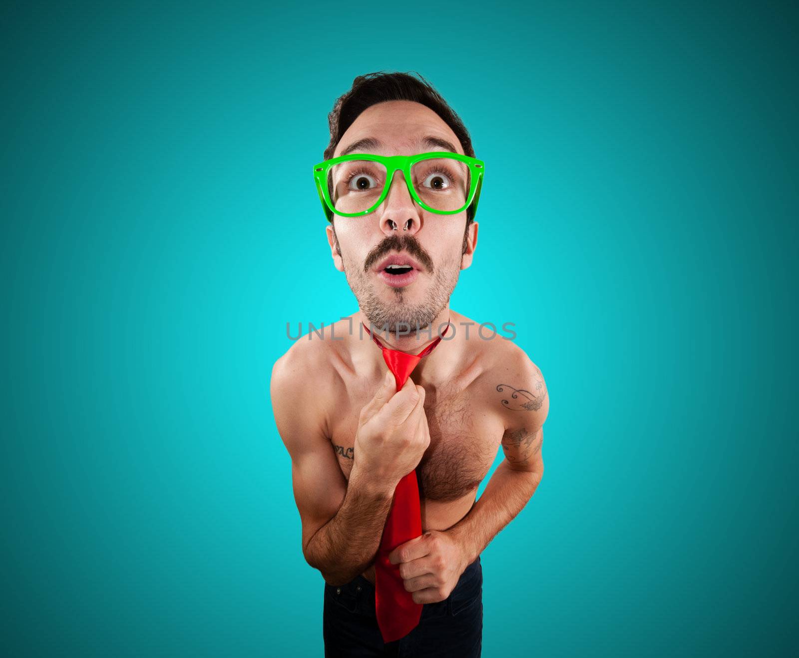 naked man wearing a red tie on blue background