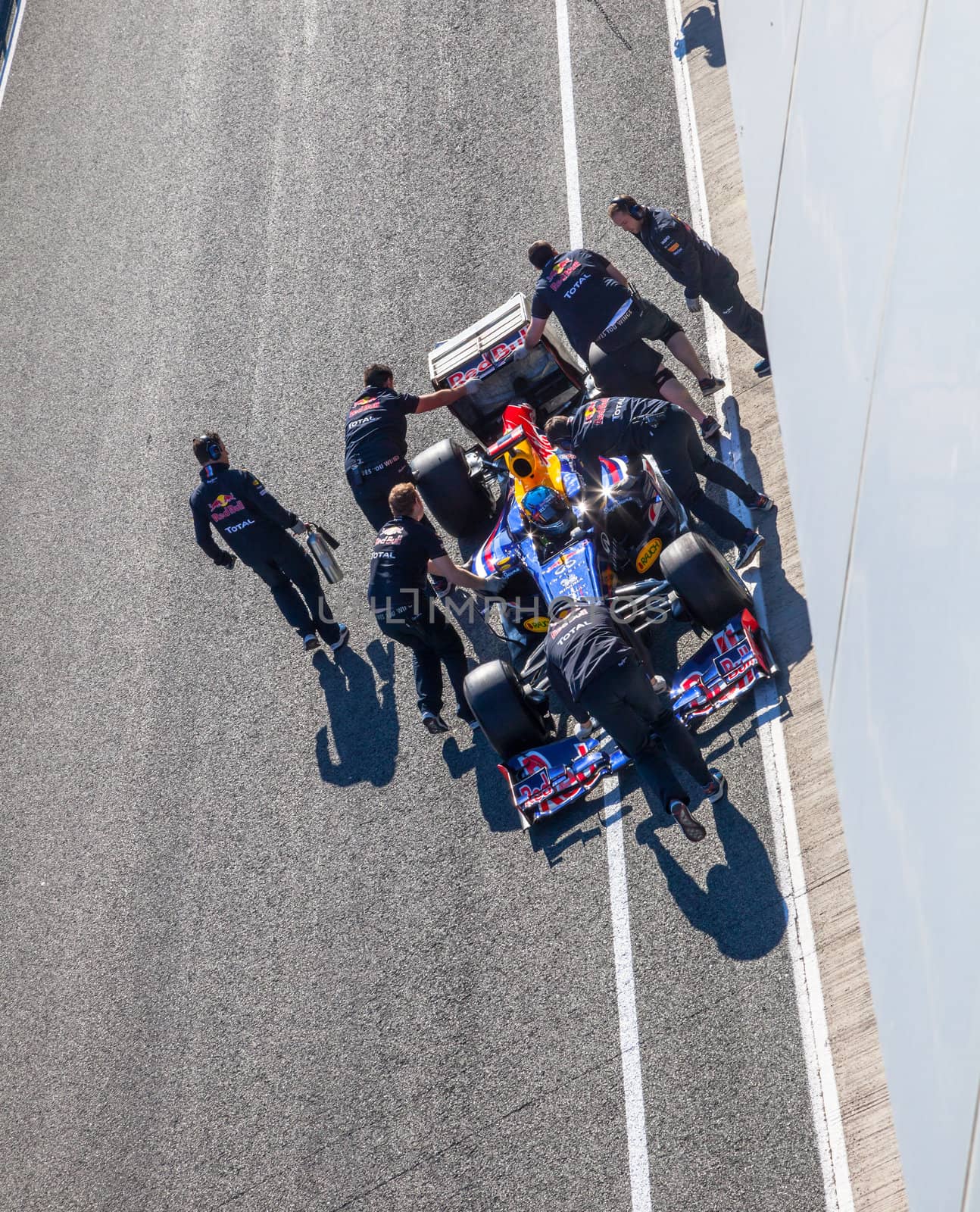 JEREZ DE LA FRONTERA, SPAIN - FEB 10: Sebastian Vettel of Red Bull F1 entering to the pit on training session on February 10 , 2012, in Jerez de la Frontera , Spain