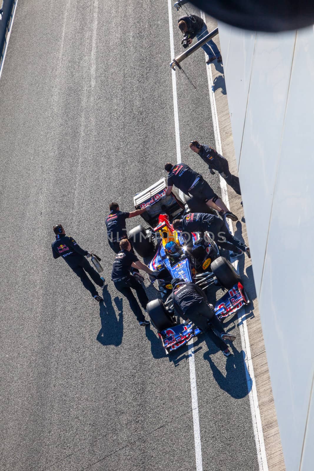 JEREZ DE LA FRONTERA, SPAIN - FEB 10: Sebastian Vettel of Red Bull F1 entering to the pit on training session on February 10 , 2012, in Jerez de la Frontera , Spain