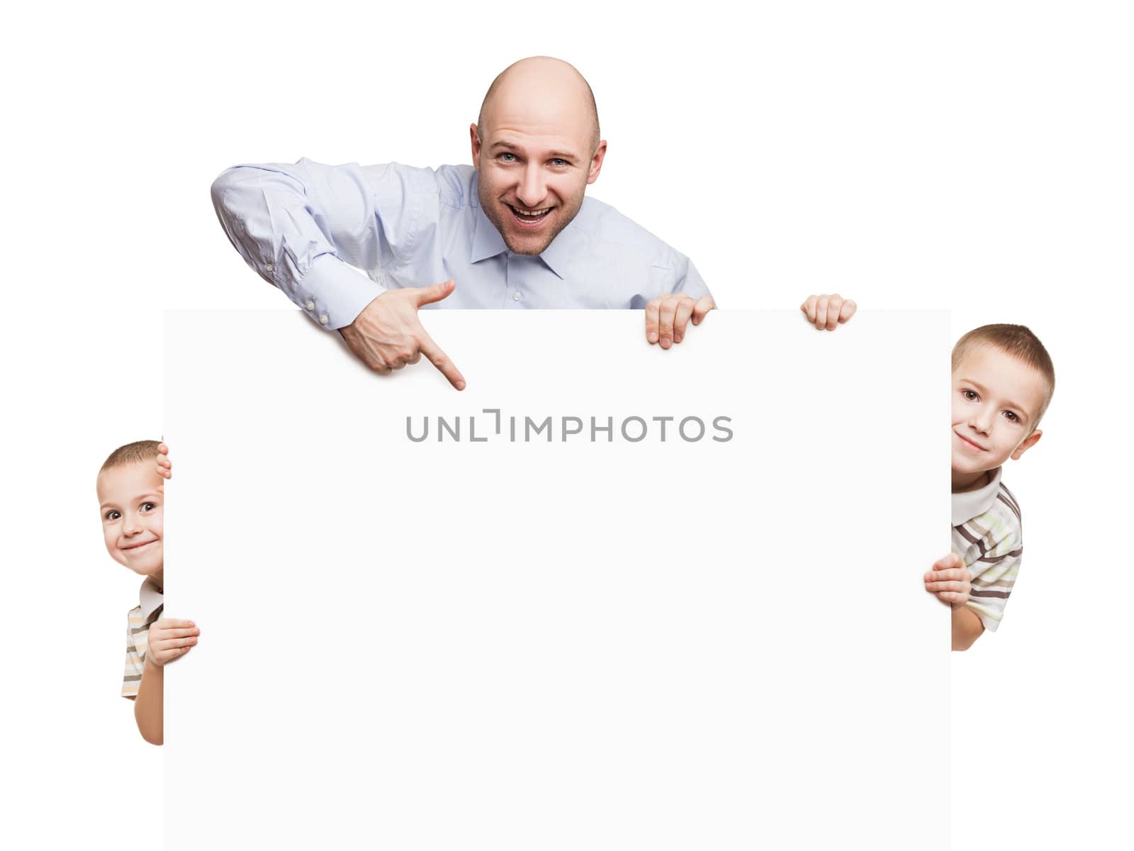 Smiling father and little sons holding blank sign or placard white isolated